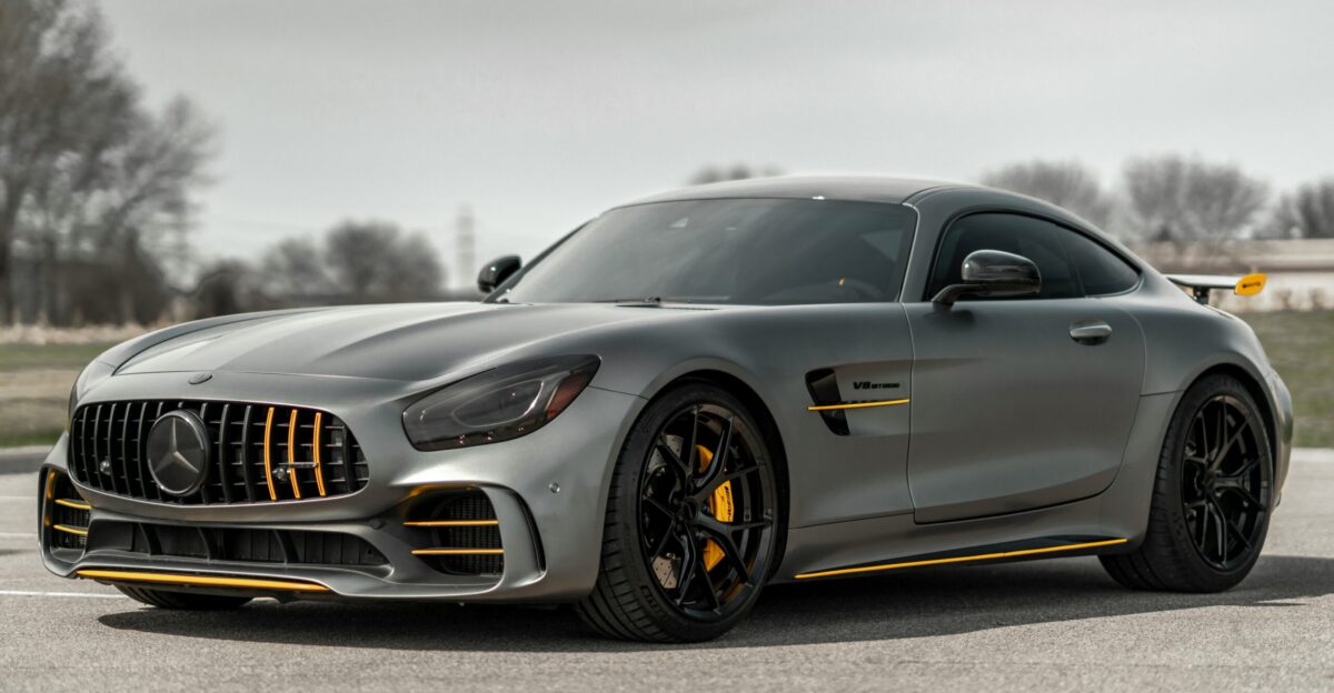 black mercedes benz coupe on gray asphalt road
