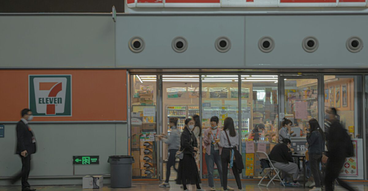 people walking in front of store