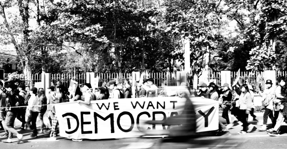 grayscale photo of people walking on street