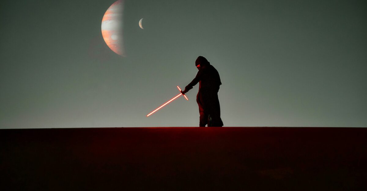 a man that is standing in the dark