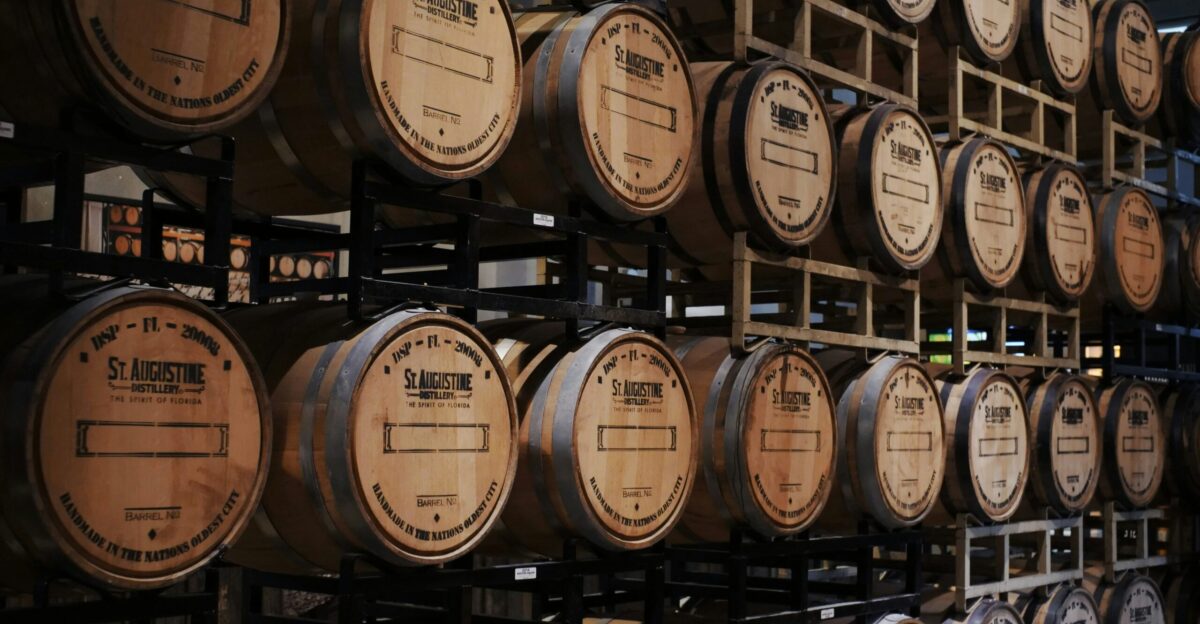 brown wooden barrels on rack