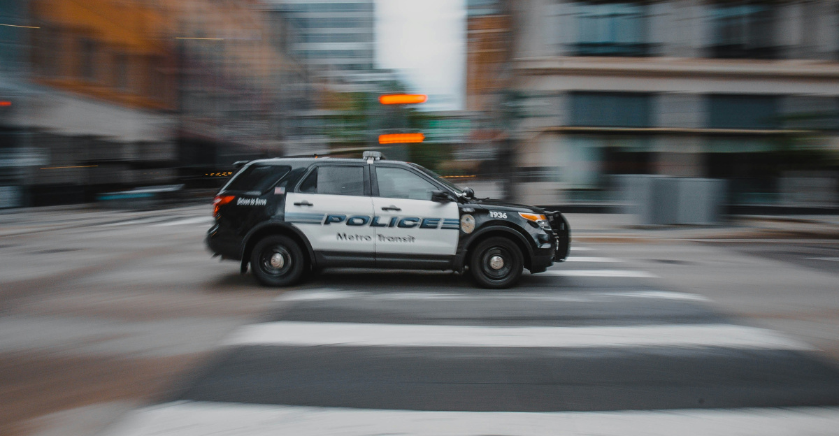 black and white police car on road during daytime