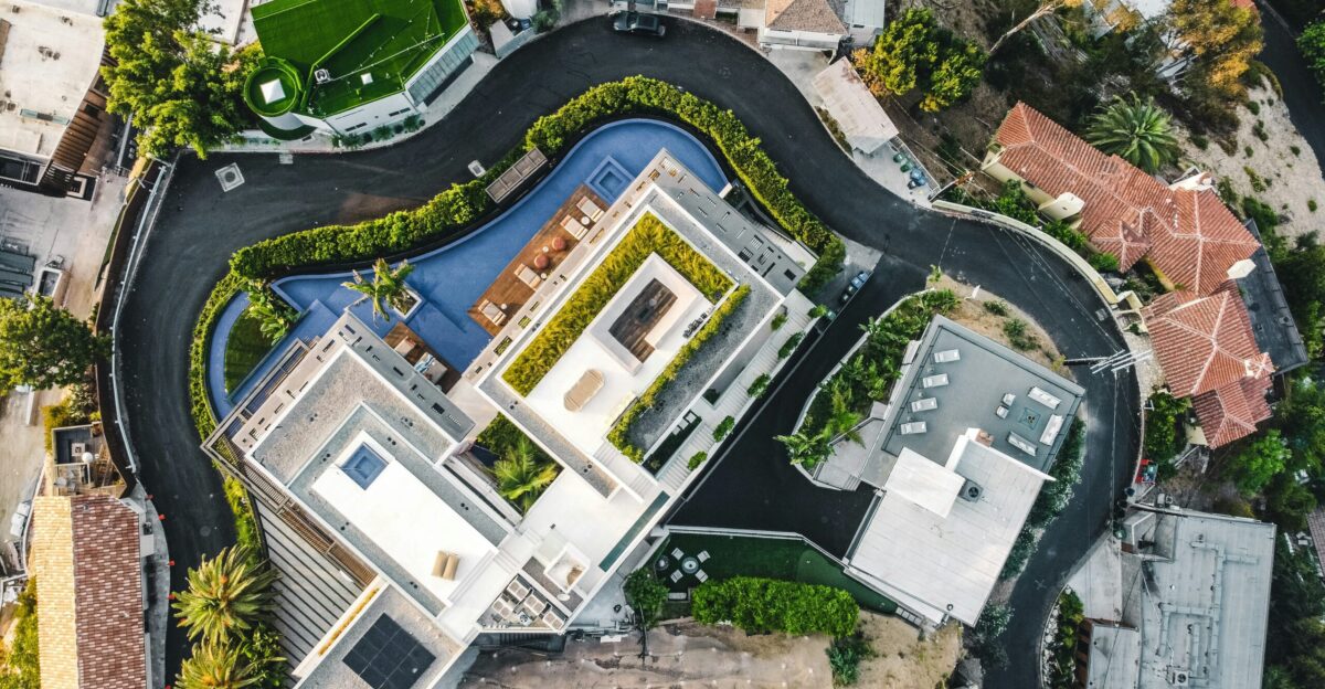 an aerial view of a house with a swimming pool