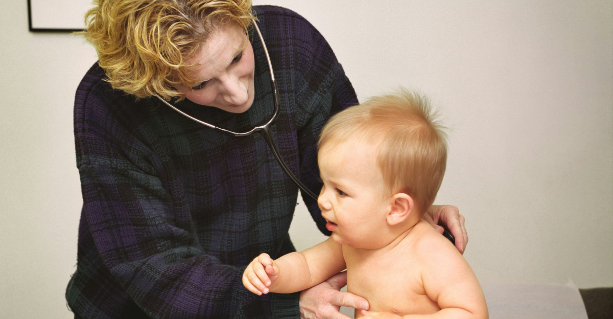 a woman holding a baby on top of a table