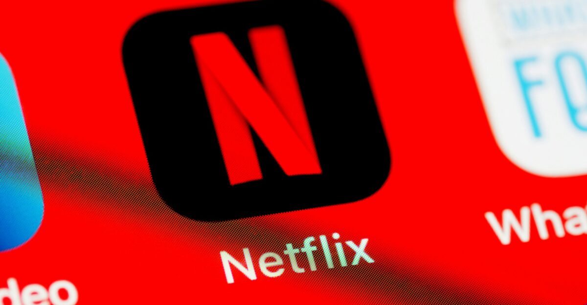 a close up of a red screen with different logos