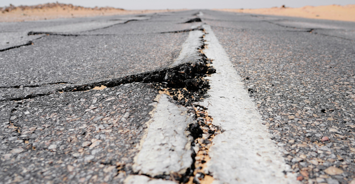 a crack in the middle of a road in the middle of nowhere