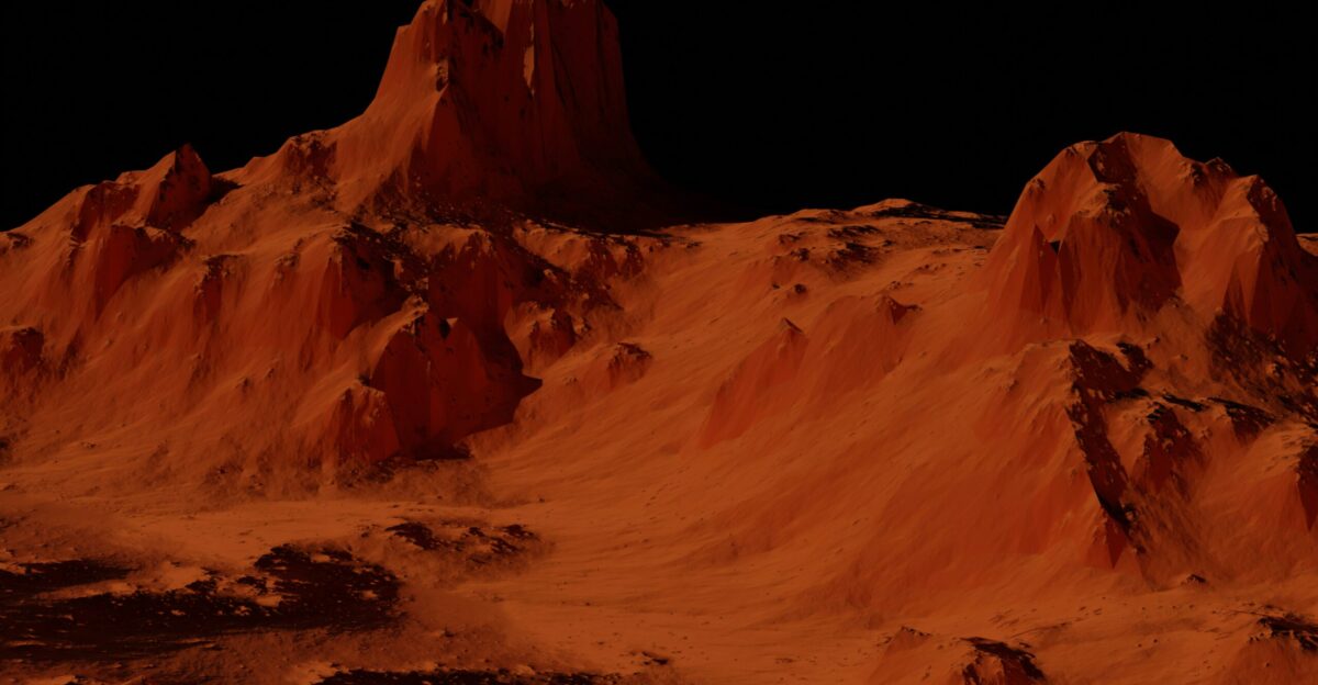 a group of mountains covered in sand at night