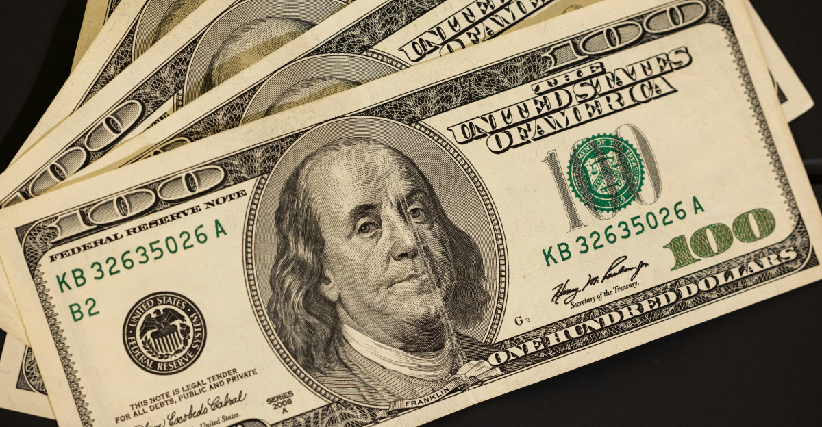 a stack of twenty dollar bills sitting on top of each other