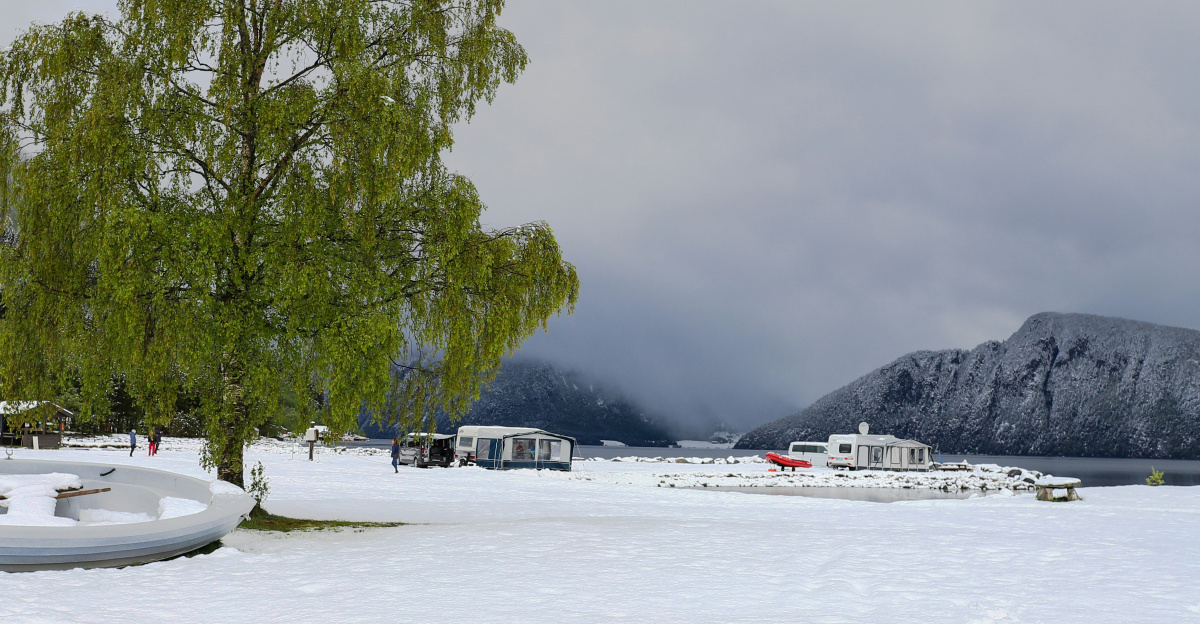 a boat sitting on top of a snow covered field