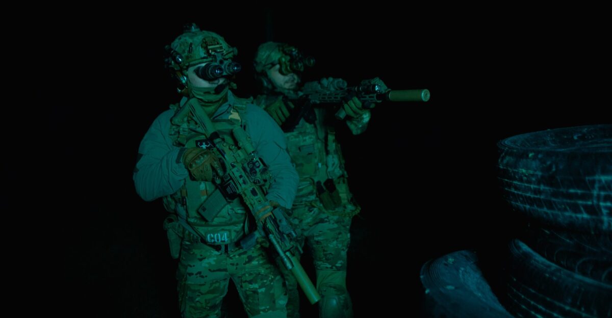 a couple of soldiers standing next to each other