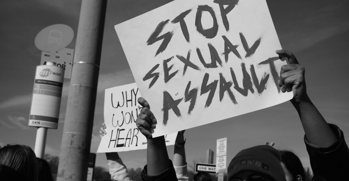 a group of people holding up signs in the air