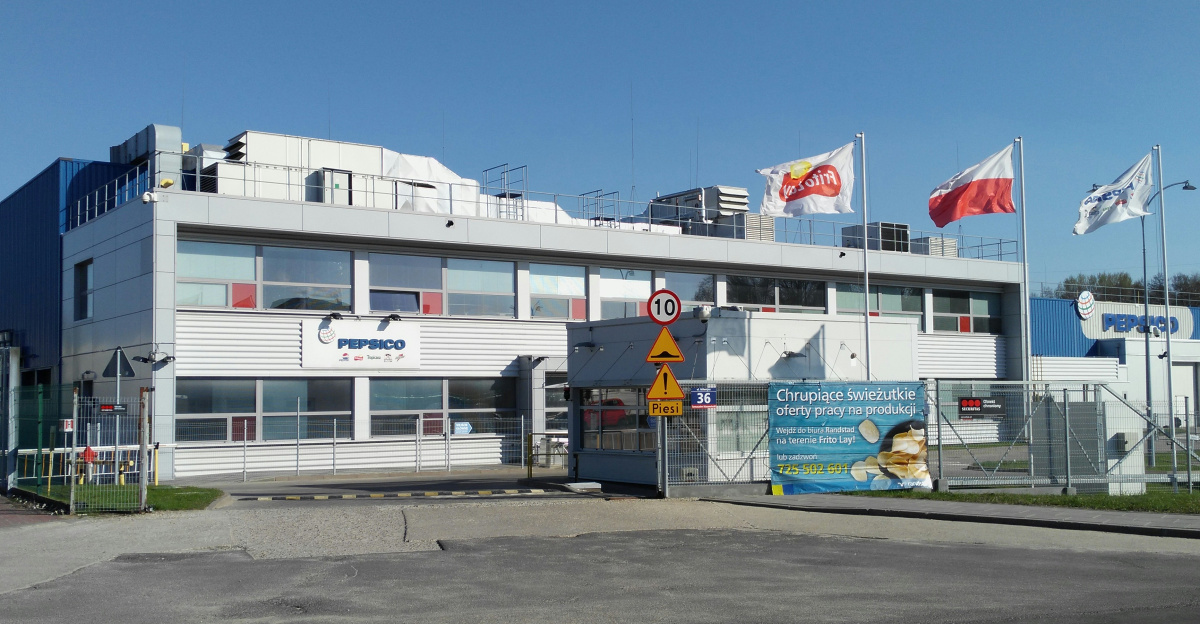 a large building with flags on top of it