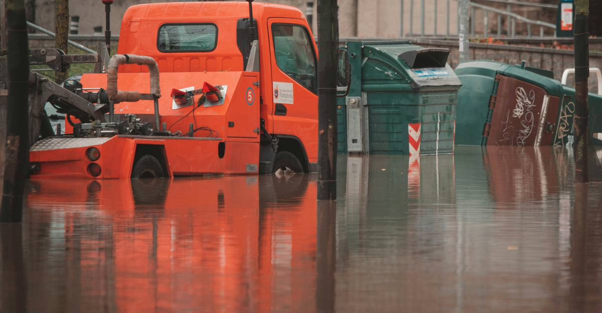 a truck is parked in a flooded street
