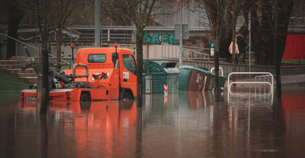 a truck is parked in a flooded street