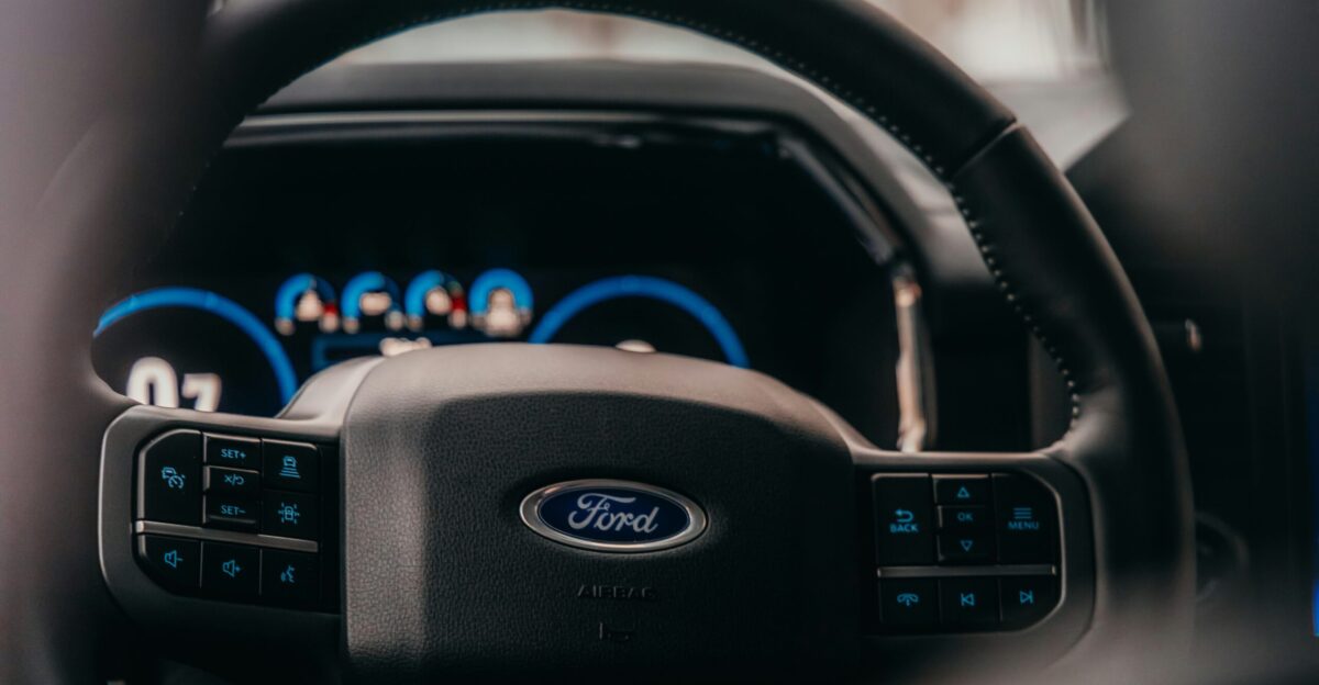 a close up of the steering wheel of a car