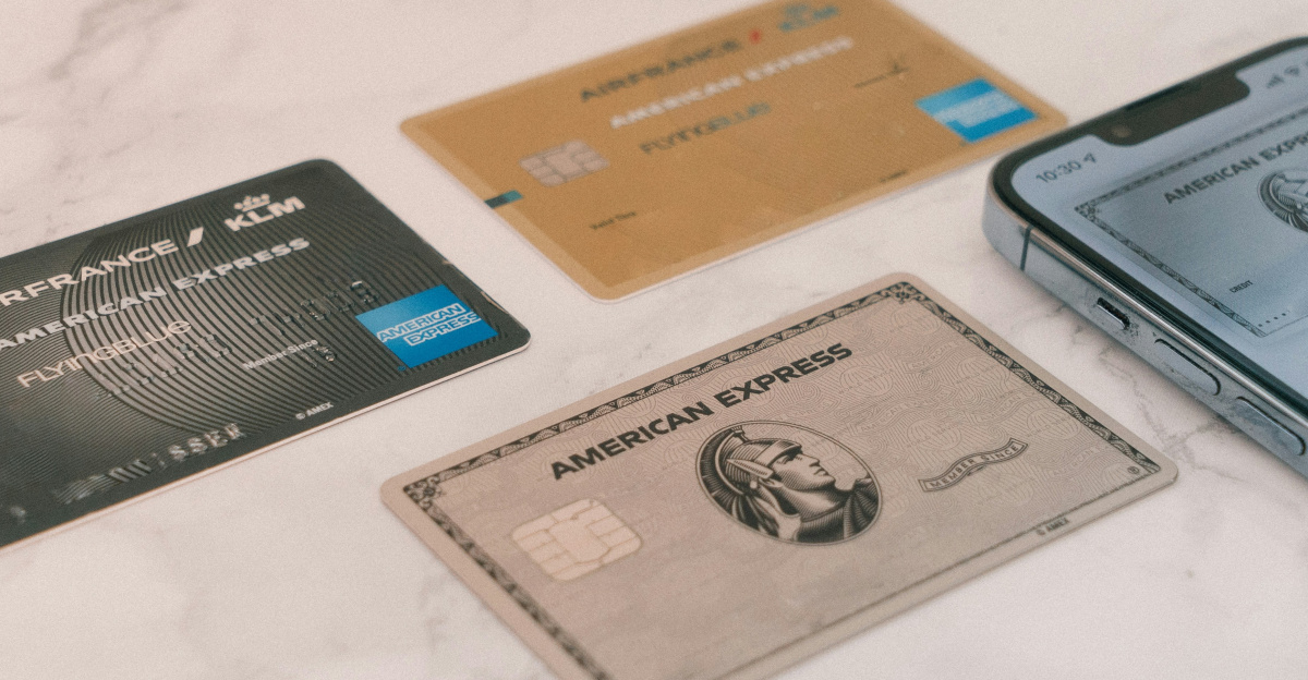 a group of credit cards sitting next to a cell phone