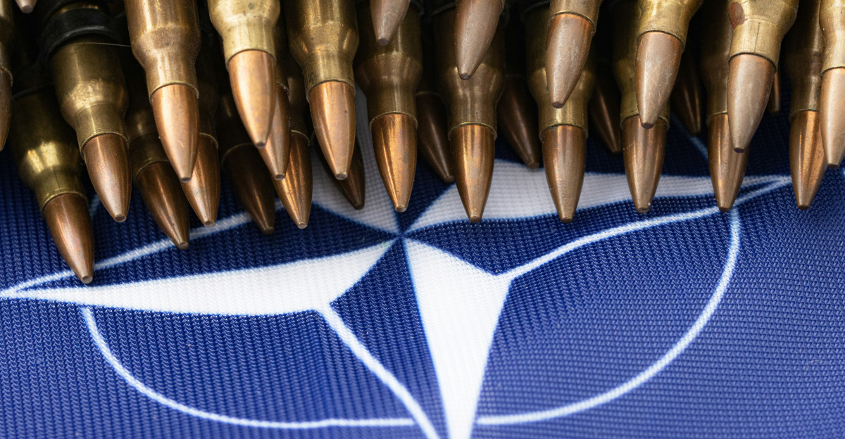 a bunch of bullet like objects on a blue background