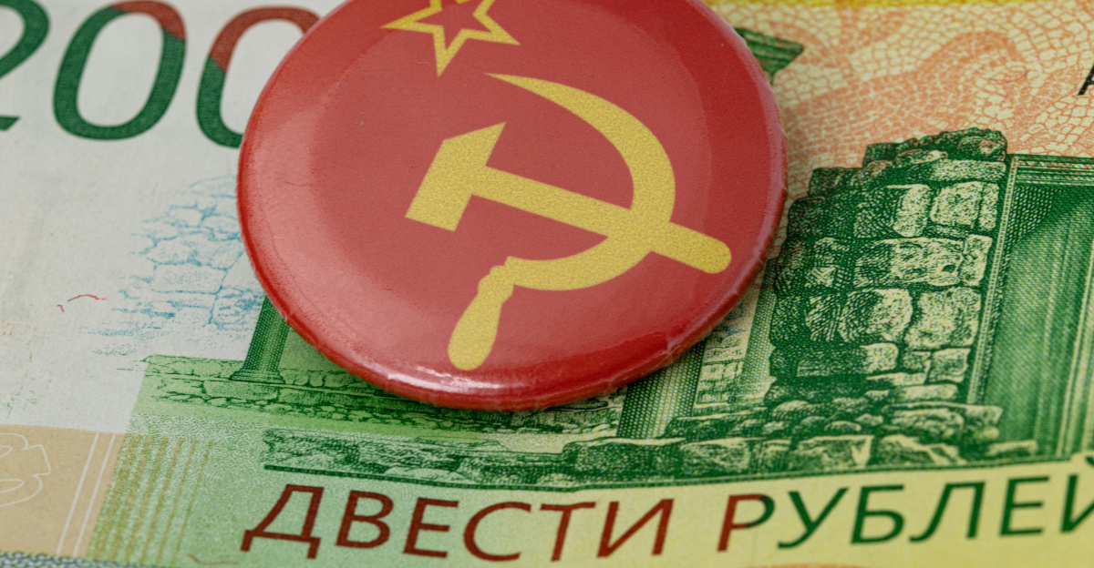 a red button with a hammer and a star on it