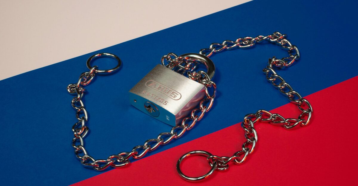 a lock and chain on a red blue and red background