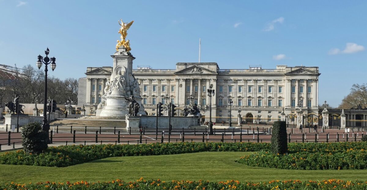 a large building with a statue in front of it