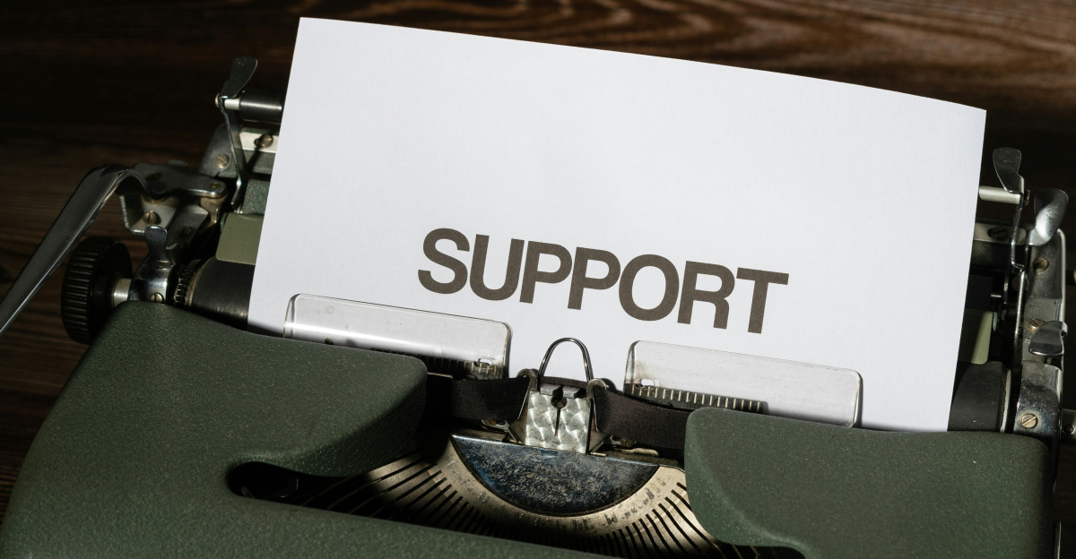 a close up of a typewriter with a paper on it