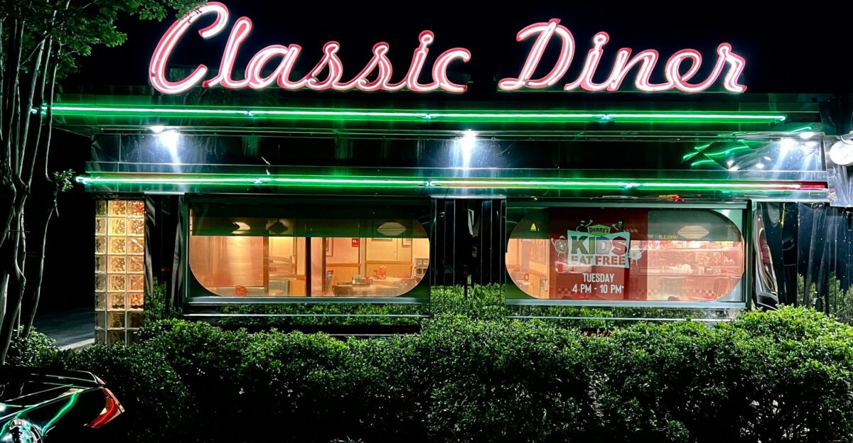 a green building with a sign on it