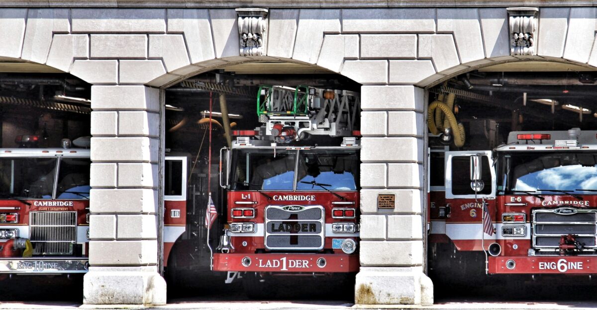 a group of fire trucks in a garage