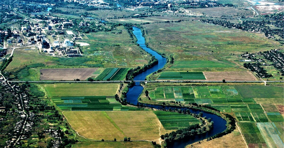 an aerial view of a road and fields