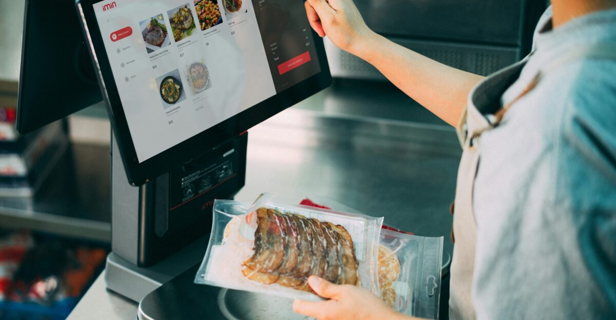 a person holding a tray of food