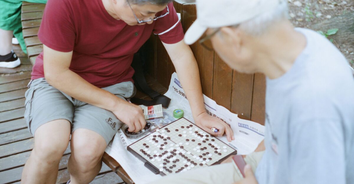 a group of people playing a board game