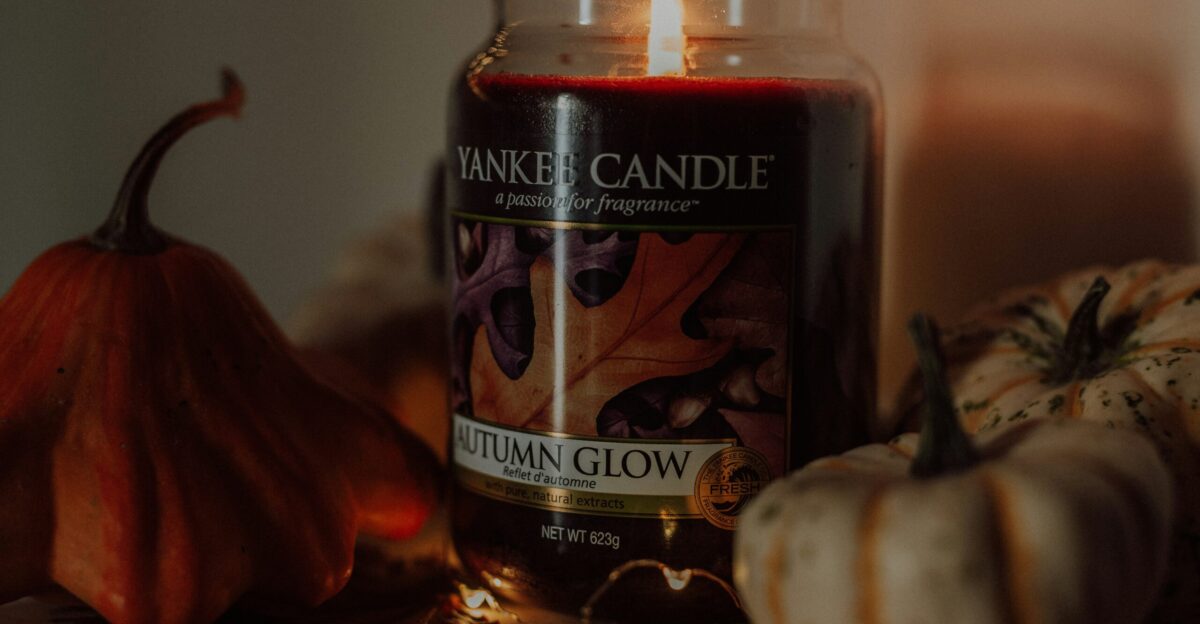 a jar of pumpkins next to a pumpkin