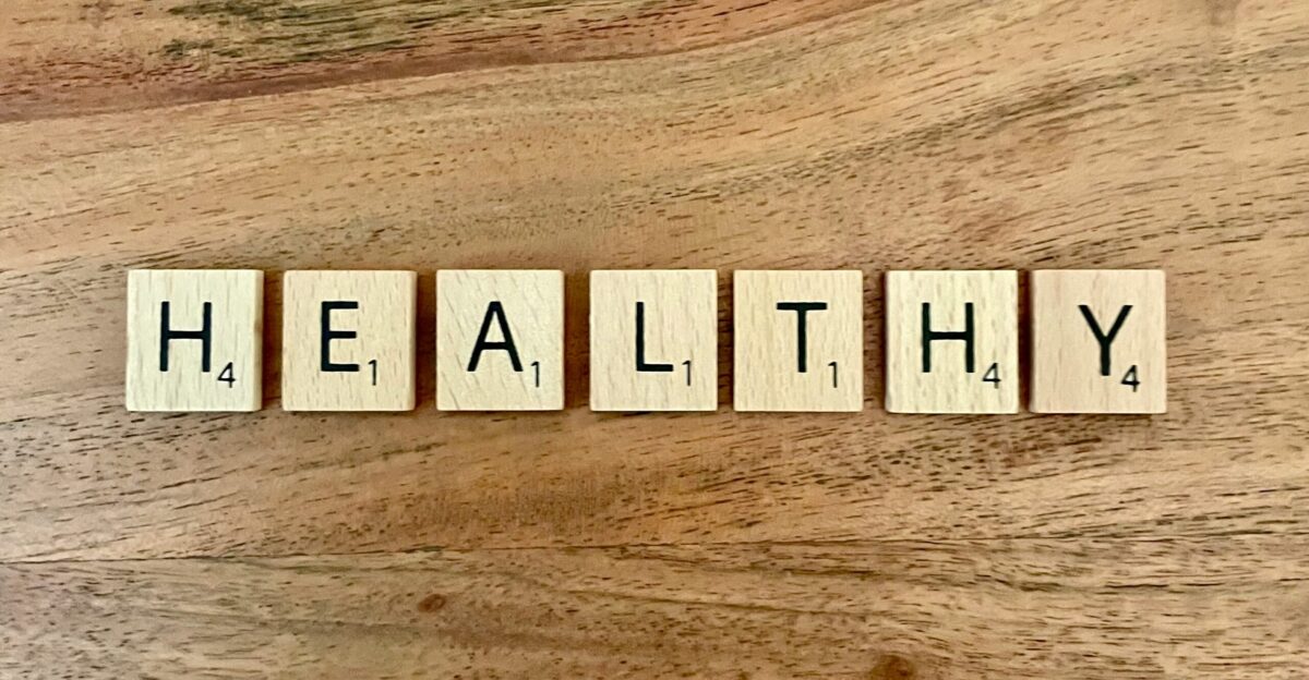 a group of white boxes with black text on a wooden surface
