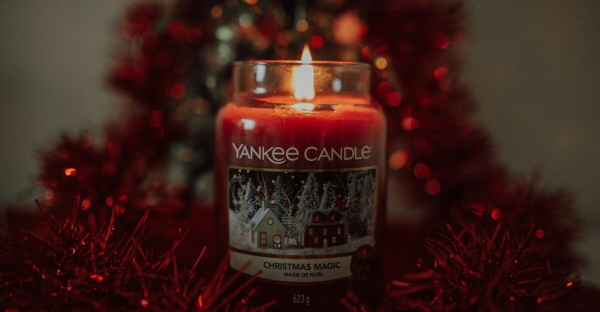 a candle in a glass jar