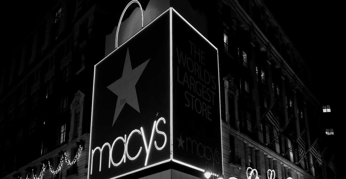 a black and white photo of macy's at night