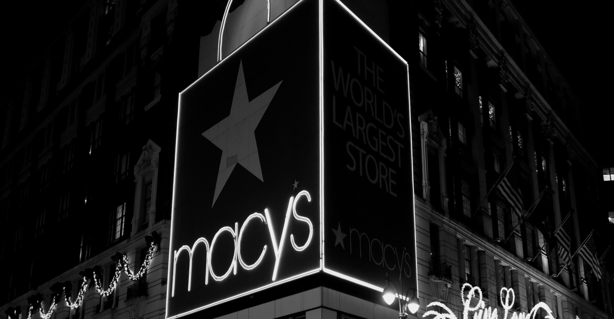 a black and white photo of macy's at night