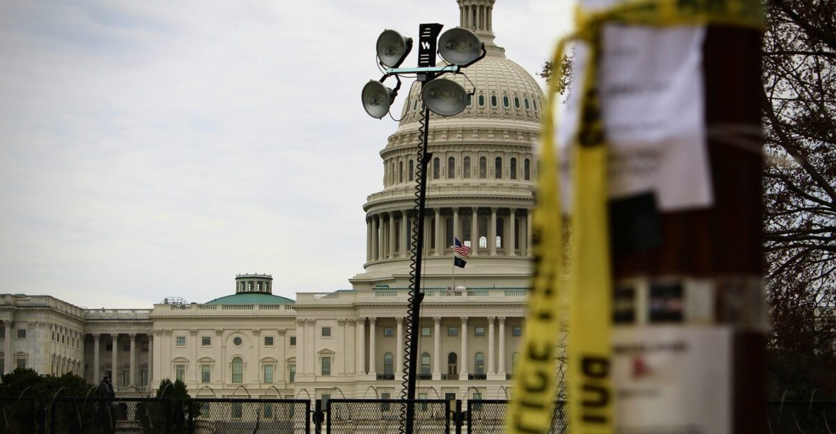 the capitol building with a measuring tape in front of it