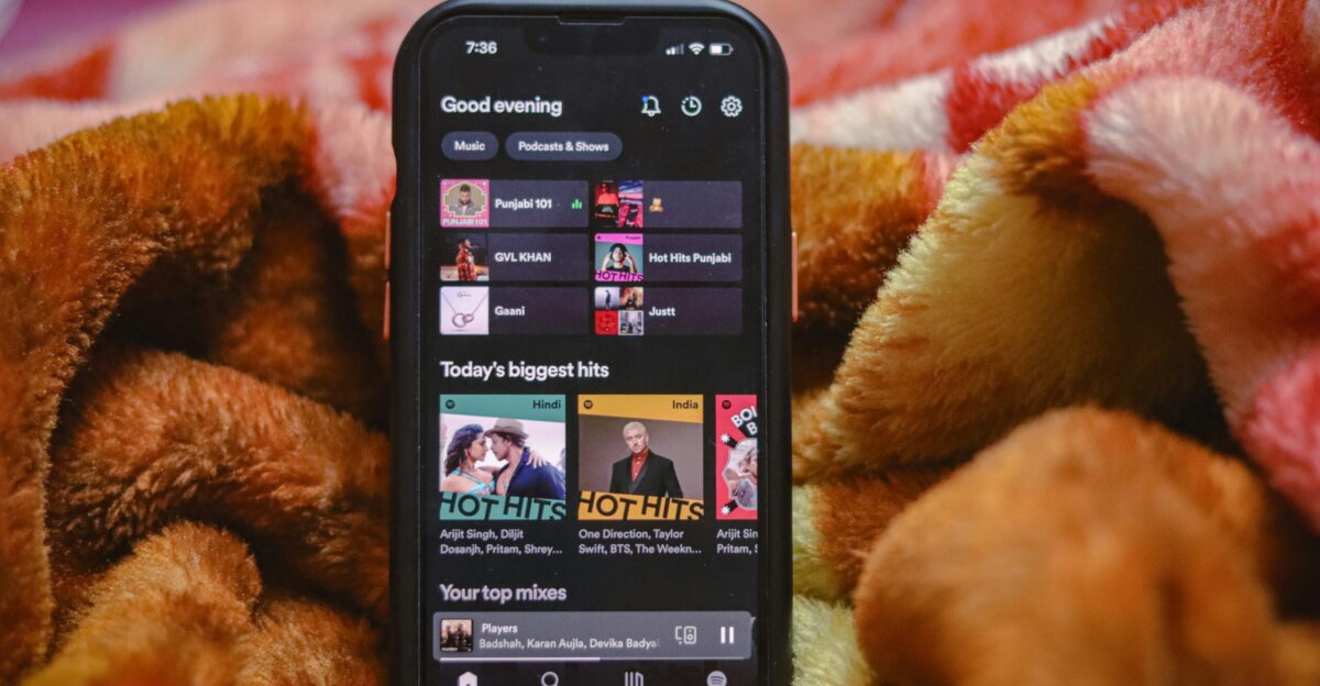 a close up of a cell phone on a blanket