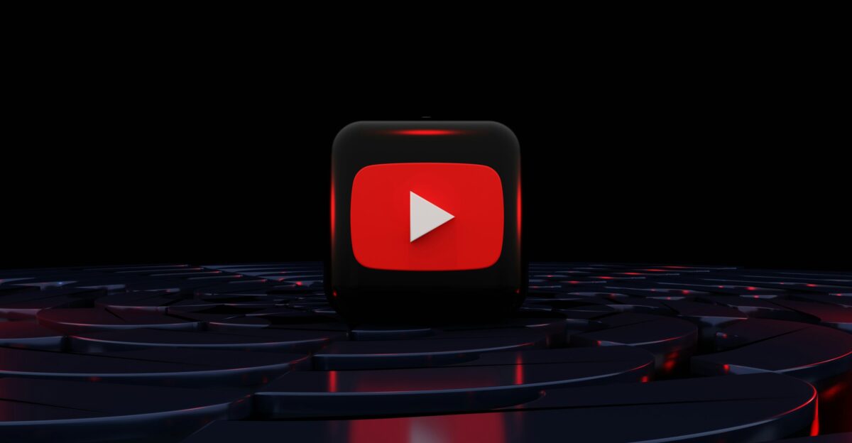 a red play button on a black background