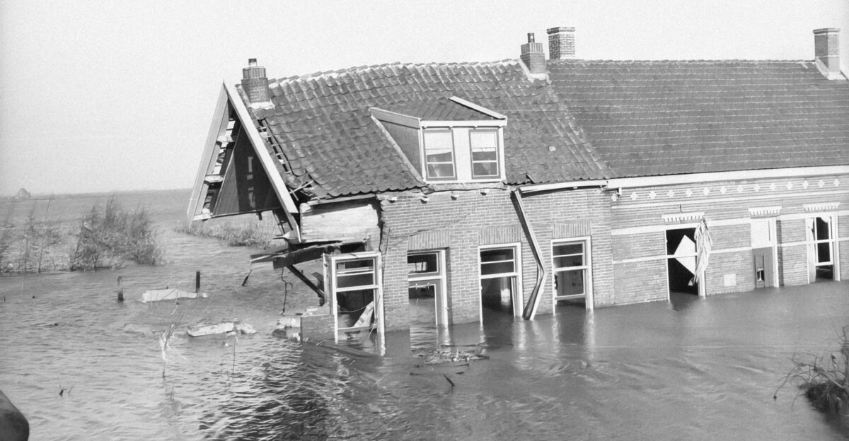 a black and white photo of a flooded house