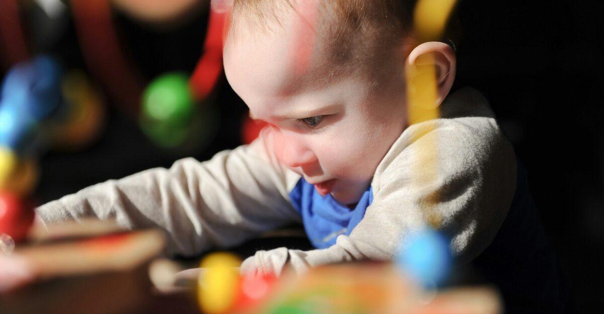 a young child playing with toys in a room