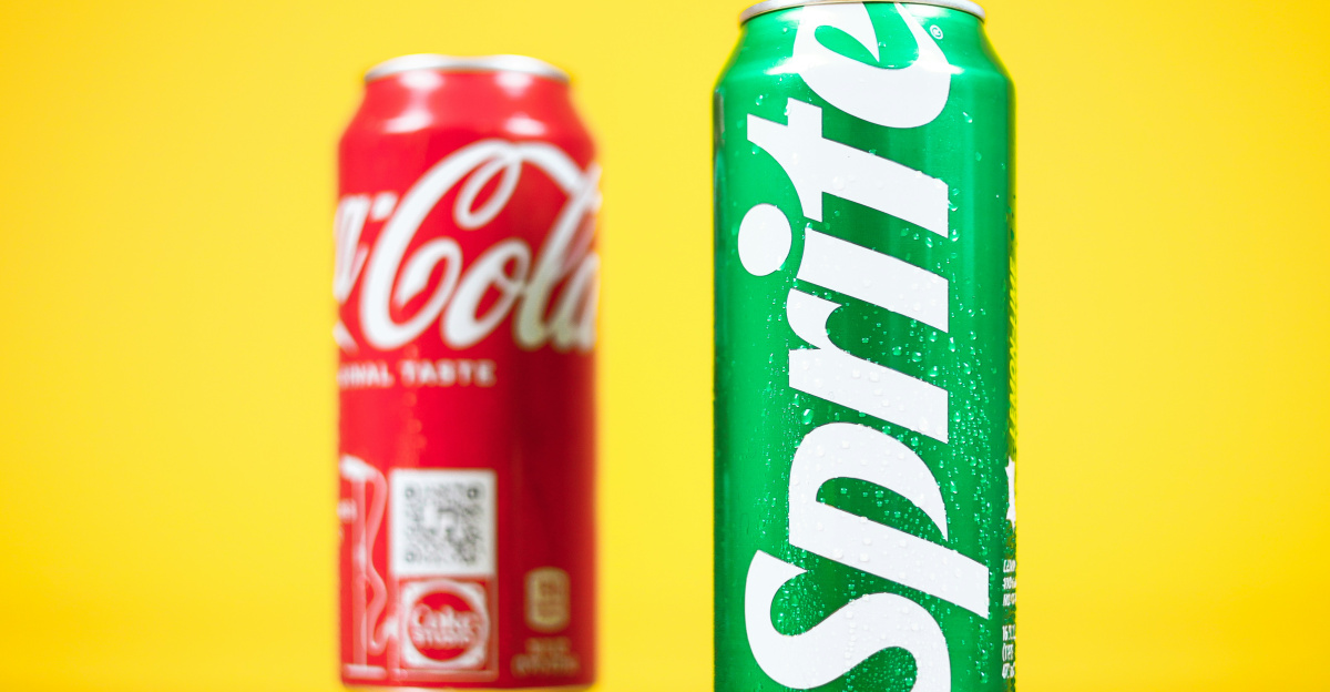 a couple of soda cans sitting on top of a table