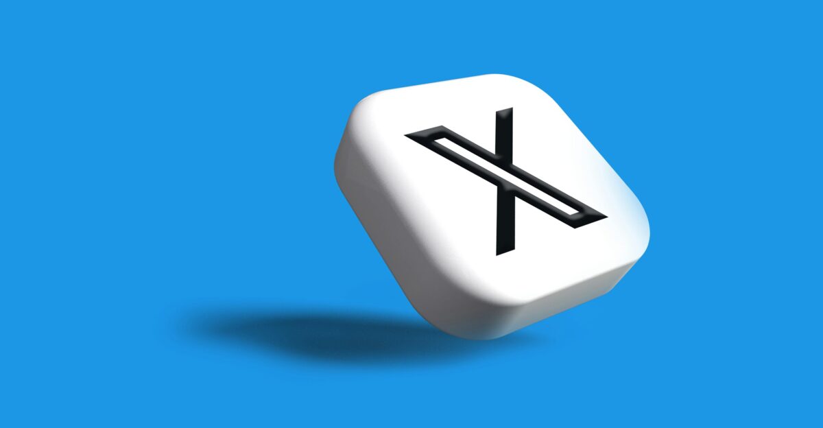 a white dice with a black x on it