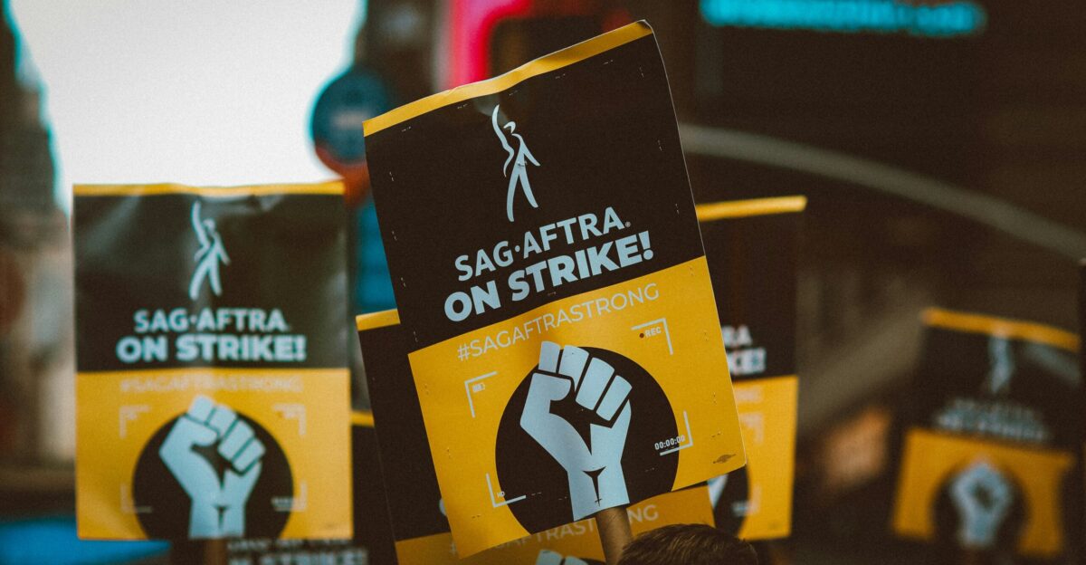 a group of people holding up protest signs