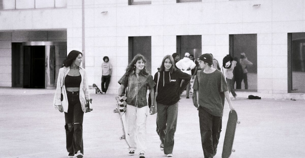 a group of young people walking down a street