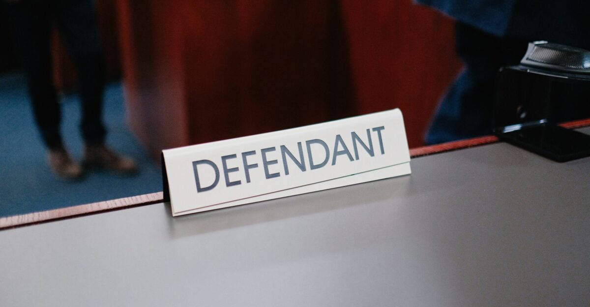 a desk with a sign on it that says defend