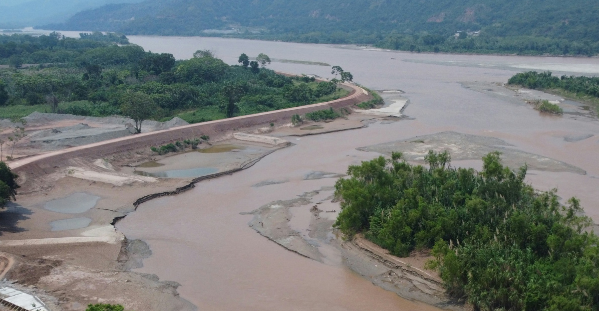 an aerial view of a river and a bridge