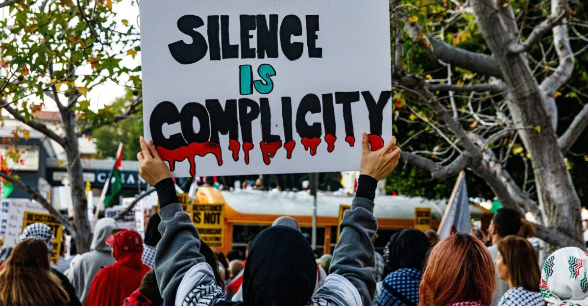 a group of people holding up a sign