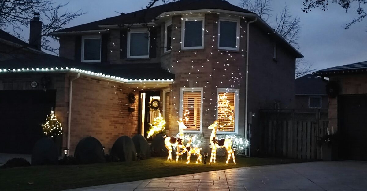 a house with christmas lights on the front of it