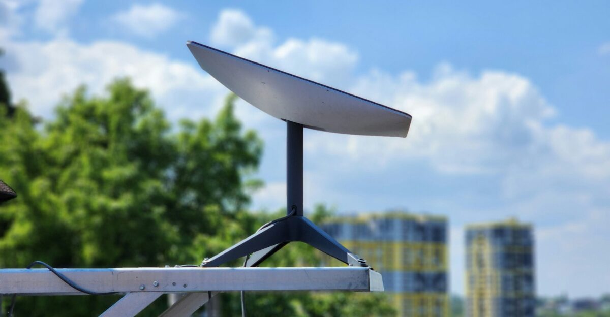 a white surfboard sitting on top of a metal pole
