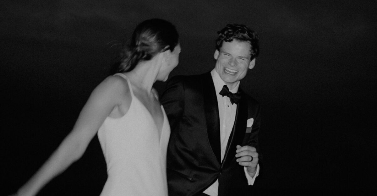 a man in a tuxedo and a woman in a dress